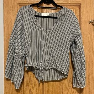 Long sleeve gray and white top with a tie at the bottom size small
